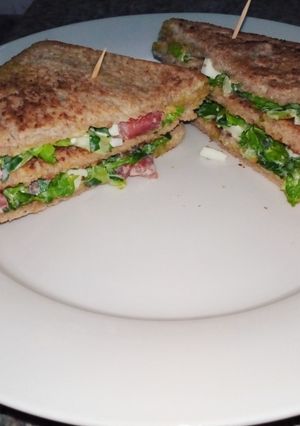 A picture of The perfect club sandwich for a working morning.