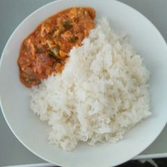 A picture of Egg sauce with sticky rice.