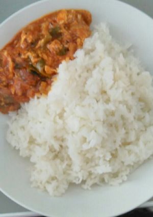 A picture of Egg sauce with sticky rice.