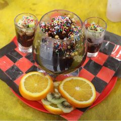 A picture of Chocolate mousse with fruit shots.