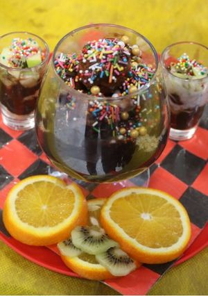 A picture of Chocolate mousse with fruit shots.