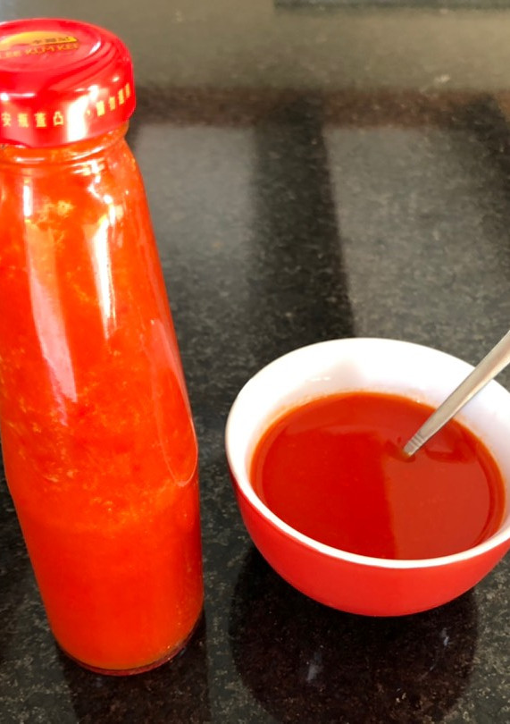 Una foto de Salsa líquida de ají chileno cacho’e cabra 🌶