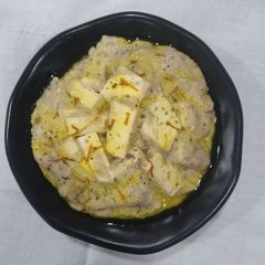 A picture of Shahi paneer with white gravy.