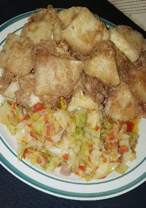 A picture of Yam and egg with cabbage source.