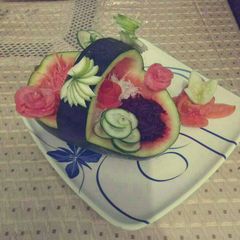 A picture of Fajita salad in watermelon basket.