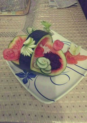 A picture of Fajita salad in watermelon basket.