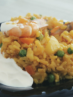 Una foto de Arroz con sepia y salsa alioli
