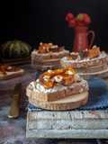 DARK MULTIGRAIN BREAD CROSTINI WITH GOAT RICOTTA, ROASTED SQUASH, AND HONEY
