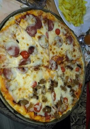 صورة لوصفة بيتزا والعجينة خيال