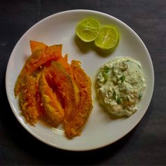 A picture of Pumpkin Fritti with Hot Honey & Creme Fraiche (Pumpkin Stir Fry).