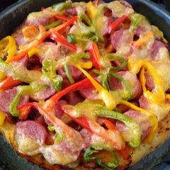Pepperoncini,bell pepper,easy peel sausage in boboli pizza crust A picture of Pepperoncini,bell pepper,easy peel sausage in boboli pizza crust.