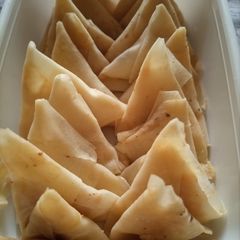 A picture of Triangle shape Mini Samosa.