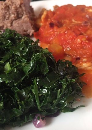 A picture of Fried kales with brown ugali.