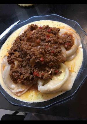 Una foto de Agnolotis c/salsa bolognesa y blanca