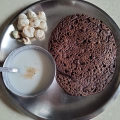 A picture of Raw potato and kuttu flour/Buckwheat pancakes.