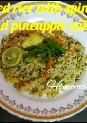 A picture of Fried rice with spinach and pineapple.