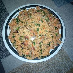 A picture of Native  jollof rice and spinach.