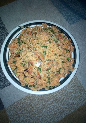 A picture of Native  jollof rice and spinach.