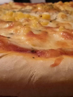 Una foto de Pizza de mamá