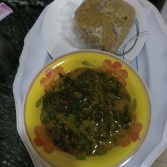 A picture of Bitterleaf soup with wheat.