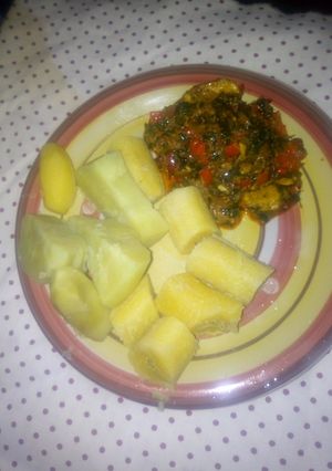 A picture of Boiled sweet potato and plantain with ugwu stew.