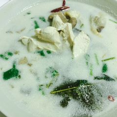 A picture of Galangal chicken coconut soup.