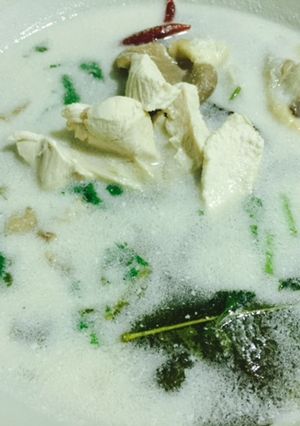 A picture of Galangal chicken coconut soup.