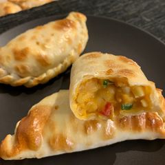 A picture of Corn and Cheese Baked Empanadas.