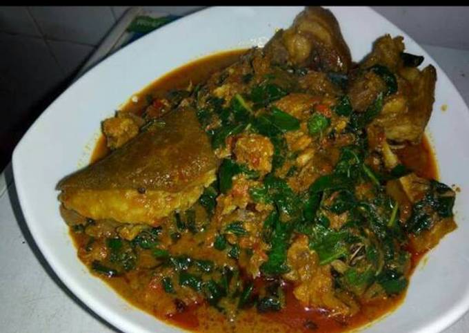 Banga soup with goat meat and scent leaves