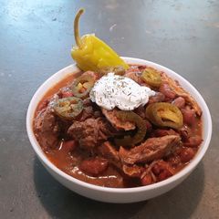 A picture of Creole red beans and rice with slow cooked pulled pork.
