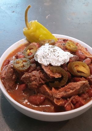 A picture of Creole red beans and rice with slow cooked pulled pork.