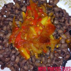 A picture of Beans with red oil pepper and onion sauce.