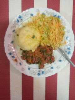 A picture of Creamy mashed potatoes, minced meat and cabbage.