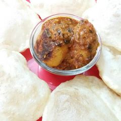 A picture of Bengali luchi r aloo dum.