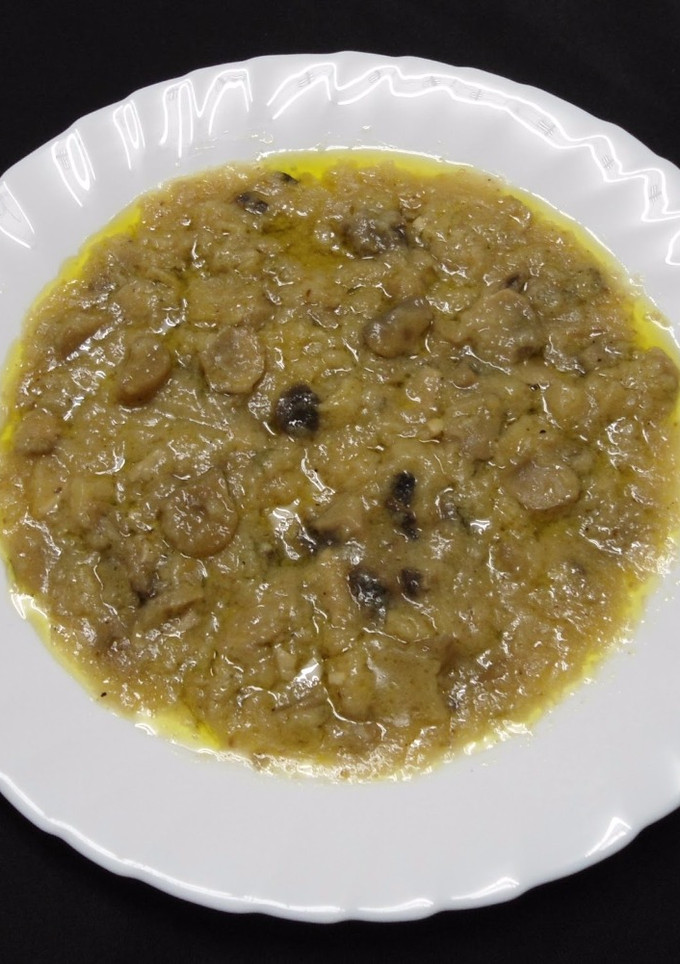 Una foto de Champiñones en salsa
