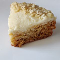 A picture of Carrot cake with cream cheese frosting.