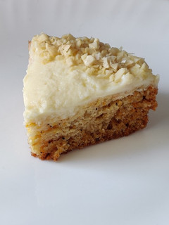 A picture of Carrot cake with cream cheese frosting.