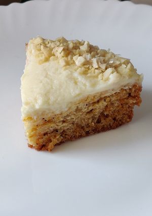A picture of Carrot cake with cream cheese frosting.