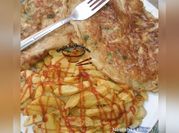 A picture of chips with ketchup