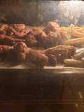 Baked spicy honey chicken wings with potatoes