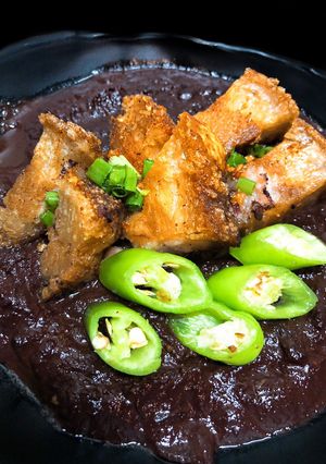 A picture of Crispy Pork Blood Stew (Dinuguan).