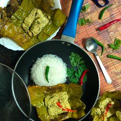 A picture of Chanar Paturi (Paneer / Cottage Cheese cooked in Banana Leaf).