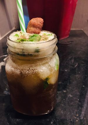 A picture of Sugarcane juice with mint.