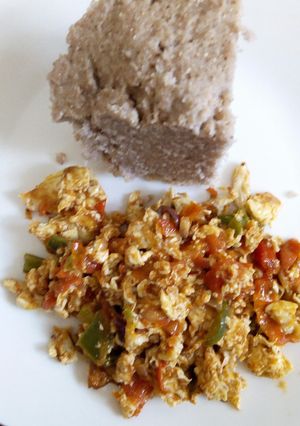 A picture of Fried eggs with Brown Ugali.