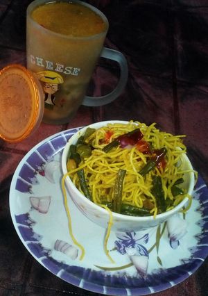 A picture of Chowmin biryani and chicken soup.