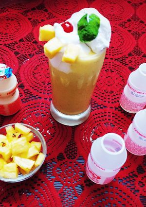 A picture of Virgin Yakult Pina Colada topped with Whipped Cream.