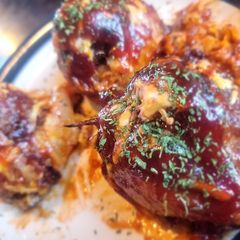 BBQ Bacon-Wrapped Burger-Stuffed Onion Bombs A picture of BBQ Bacon-Wrapped Burger-Stuffed Onion Bombs.