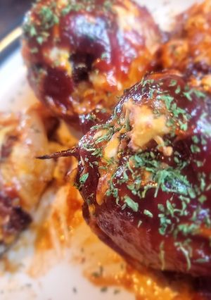 A picture of BBQ Bacon-Wrapped Burger-Stuffed Onion Bombs.