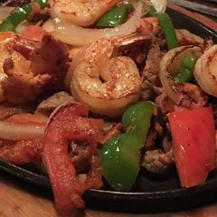 A picture of Prawns with veggies.
