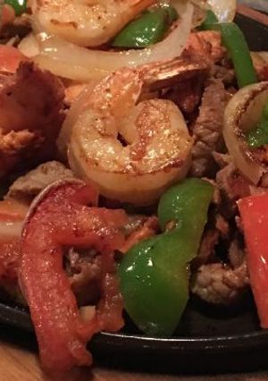 A picture of Prawns with veggies.